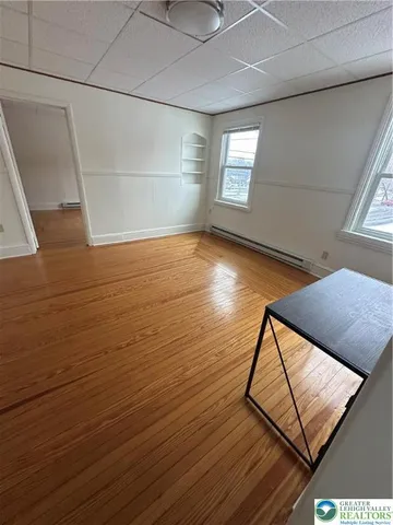 a view of an empty room with windows