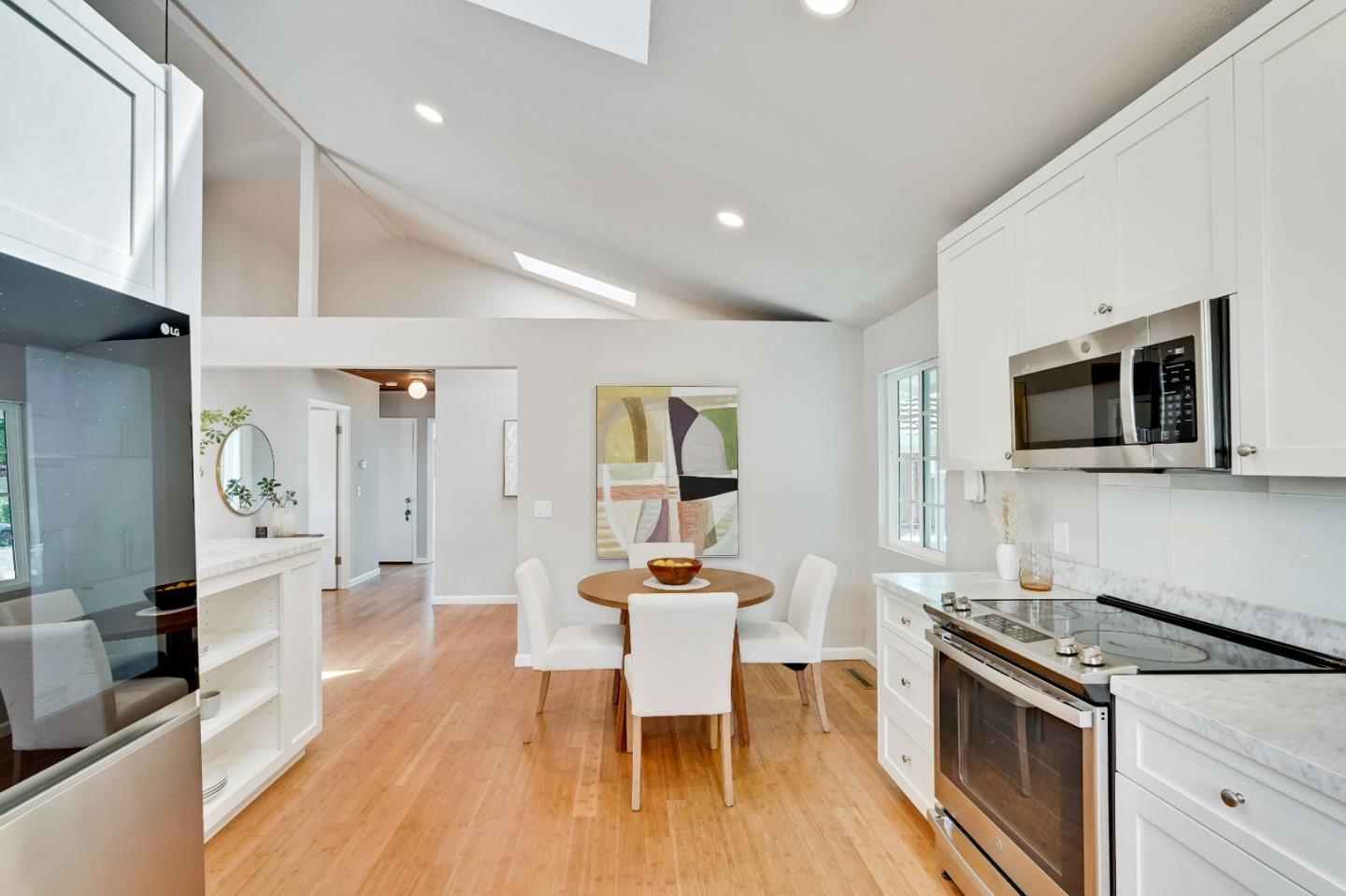 1755 Ravizza Avenue Santa Clara, CA 95051 - Photo 16 of 36 a dining room with wooden floor and stainless steel appliances
