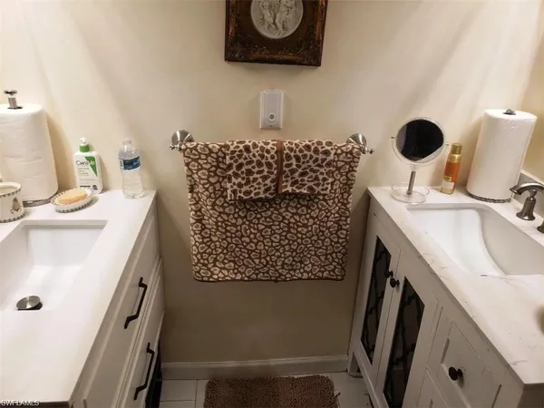 a bathroom with a sink toilet and mirror