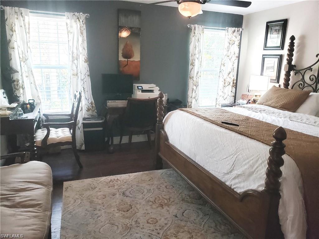 3550 23rd Avenue Southwest Naples, FL 34117 - Photo 19 of 22 a bedroom with a bed and wooden floor
