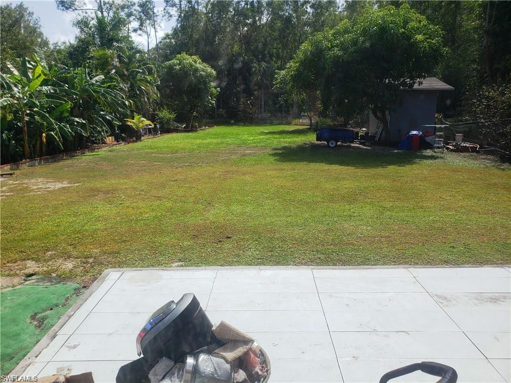 3550 23rd Avenue Southwest Naples, FL 34117 - Photo 10 of 22 a view of a lake with a sitting area