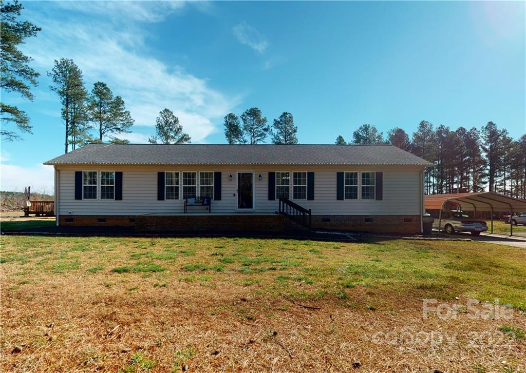 2130 Peeler Road Vale, NC 28168 - Photo 1 of 29 a view of a house with swimming pool and a yard