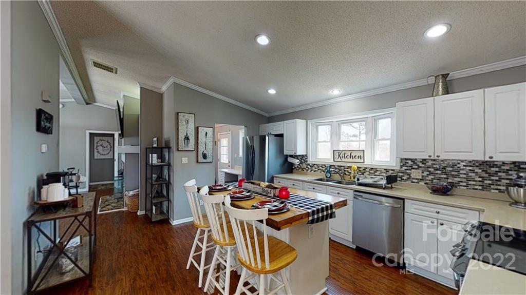 2130 Peeler Road Vale, NC 28168 - Photo 13 of 29 a kitchen with sink refrigerator and cabinets