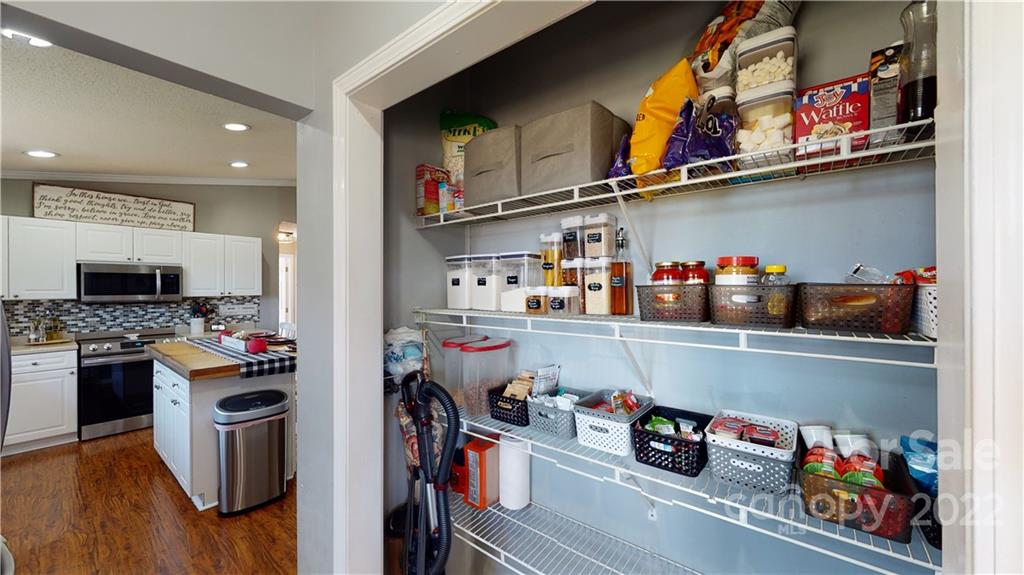 2130 Peeler Road Vale, NC 28168 - Photo 17 of 29 a kitchen with lots of clutter and stainless steel appliances