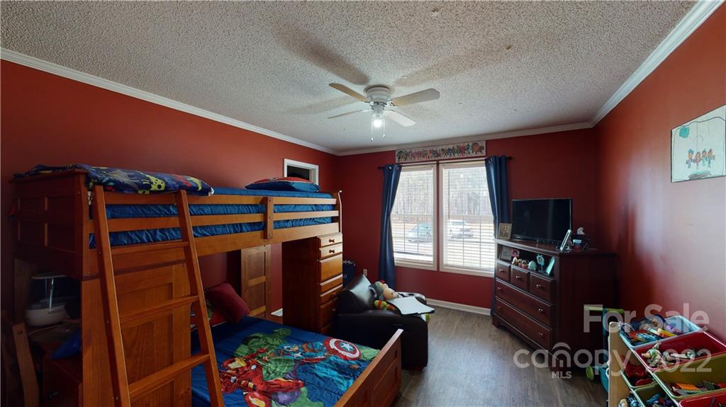 2130 Peeler Road Vale, NC 28168 - Photo 20 of 29 a room with furniture a flat screen tv and a window