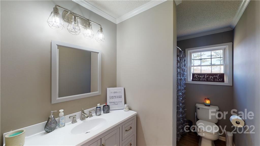 2130 Peeler Road Vale, NC 28168 - Photo 24 of 29 a bathroom with a sink mirror and vanity