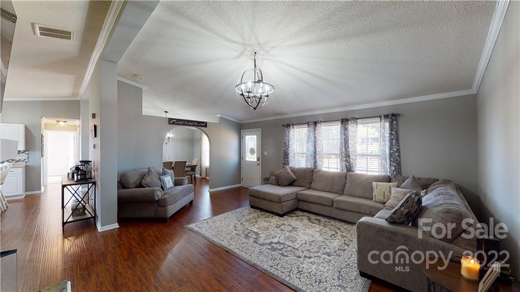 2130 Peeler Road Vale, NC 28168 - Photo 4 of 29 a living room with furniture and a chandelier
