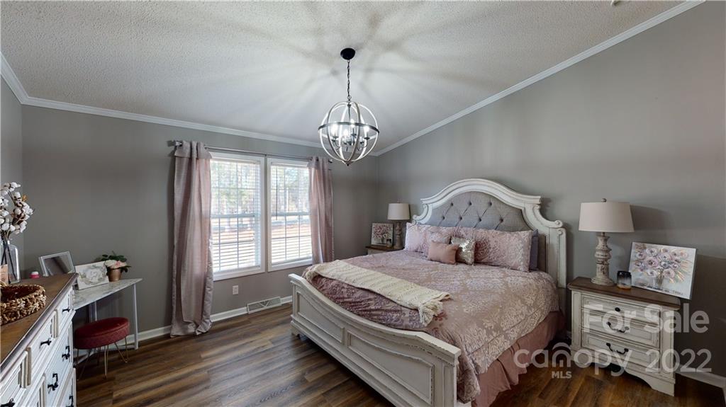 2130 Peeler Road Vale, NC 28168 - Photo 5 of 29 a bedroom with a large bed and a window