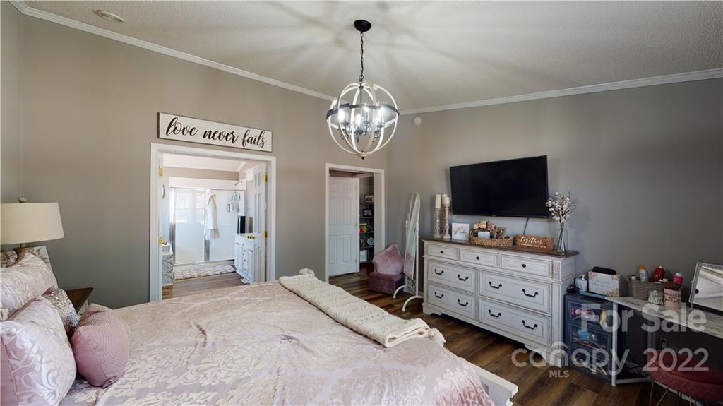 2130 Peeler Road Vale, NC 28168 - Photo 6 of 29 a bedroom with a bed and flat screen tv