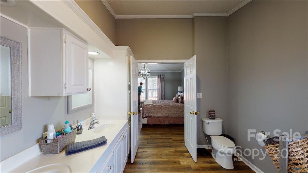 2130 Peeler Road Vale, NC 28168 - Photo 8 of 29 a en suite bathroom with a granite countertop sink and a mirror