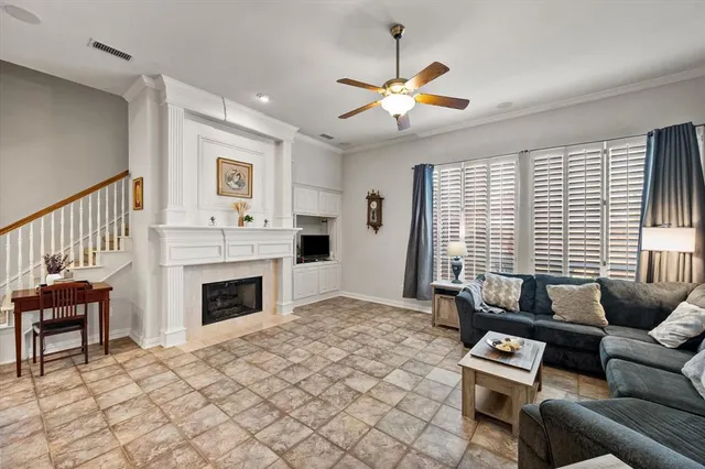 a view of a room with furniture and wooden floor