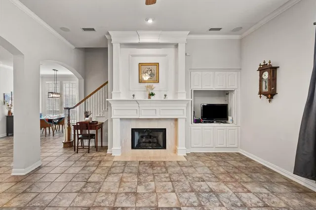 a kitchen with a sink refrigerator and cabinets