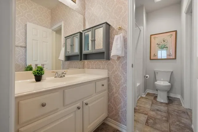 a bedroom with a workspace