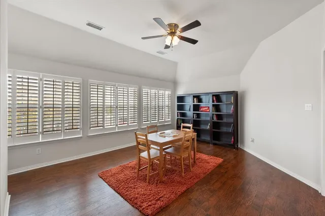 a spacious bedroom with a large bed and a window