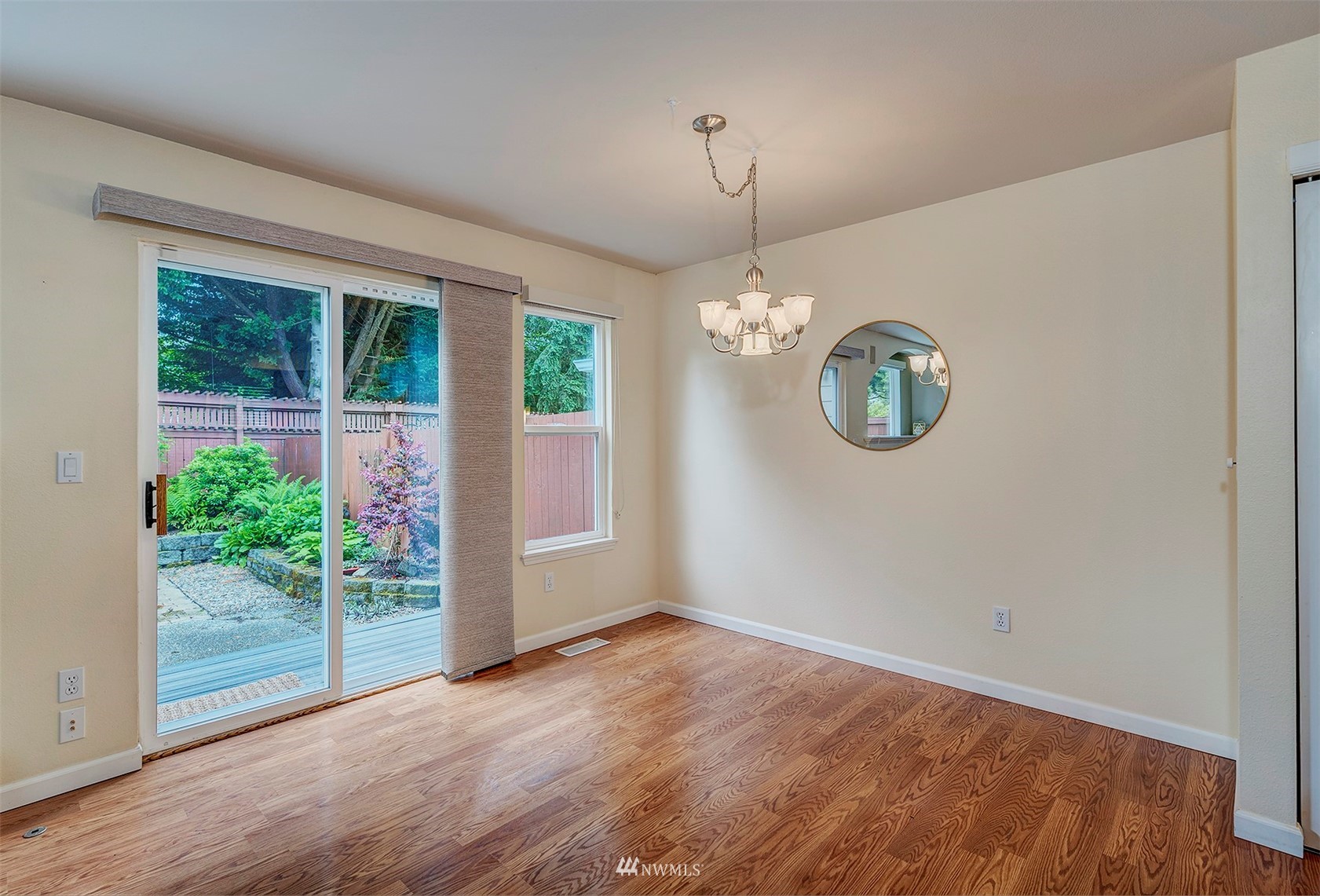 18807 19th Drive Southeast Bothell, WA 98012 - Photo 8 of 18 an empty room with wooden floor and windows