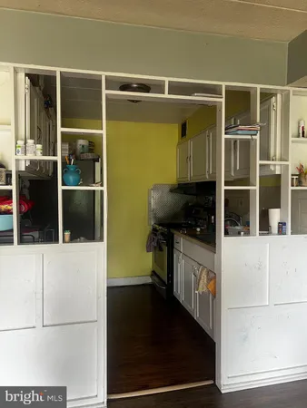 a kitchen with a refrigerator and a window