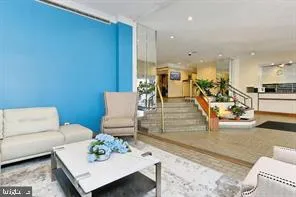 a living room with furniture and white walls