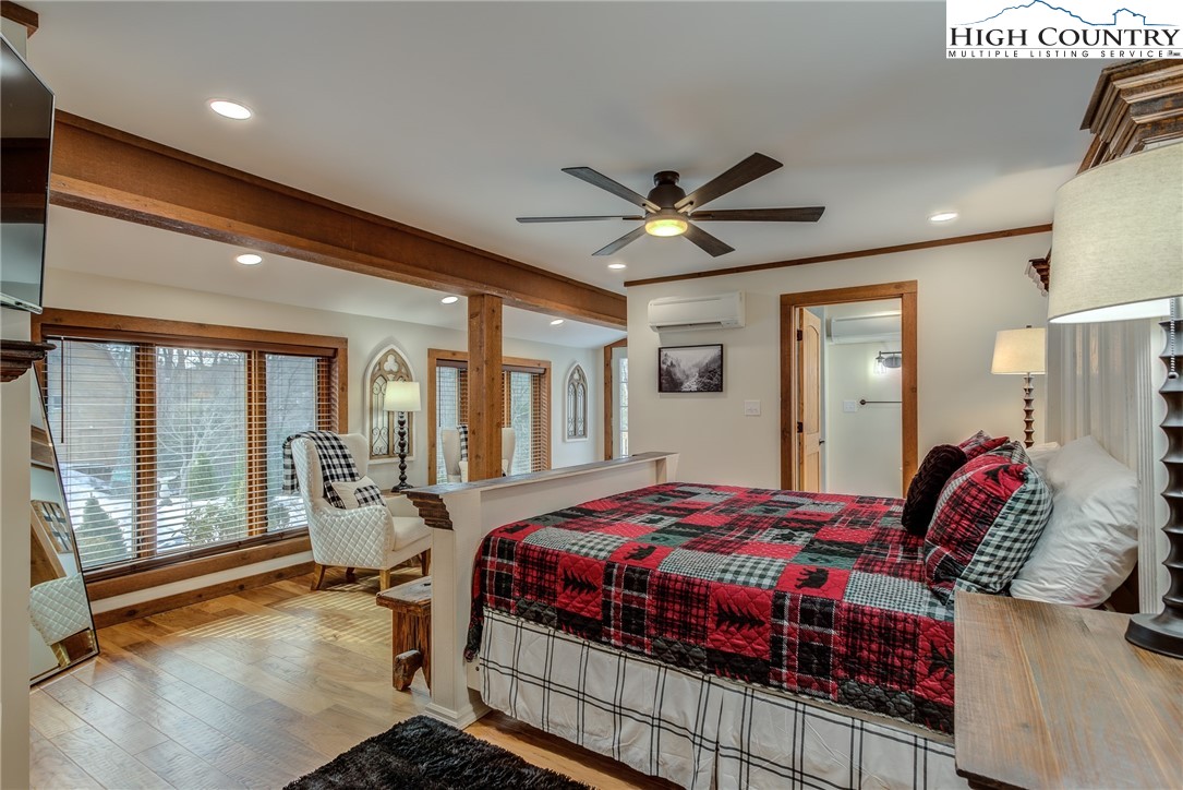 389 Auborn Trivette Road Sugar Grove, NC 28679 - Photo 20 of 49 a bedroom with a large bed and a large window