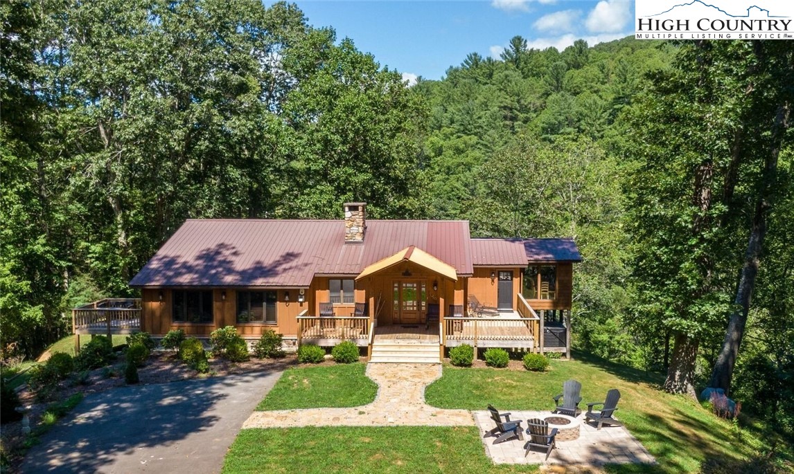 389 Auborn Trivette Road Sugar Grove, NC 28679 - Photo 2 of 49 an aerial view of a house with yard swimming pool and outdoor seating