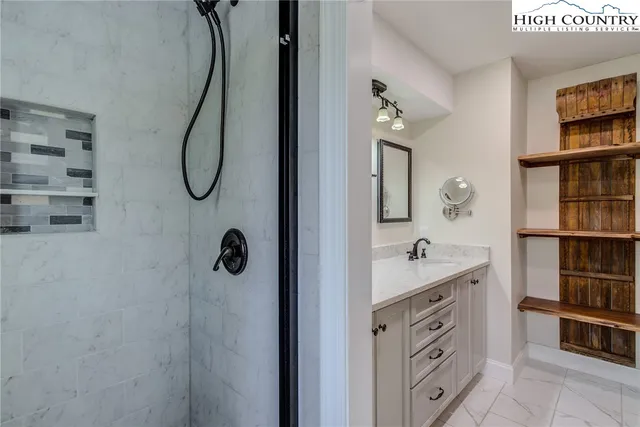 a bathroom with a sink and a large window