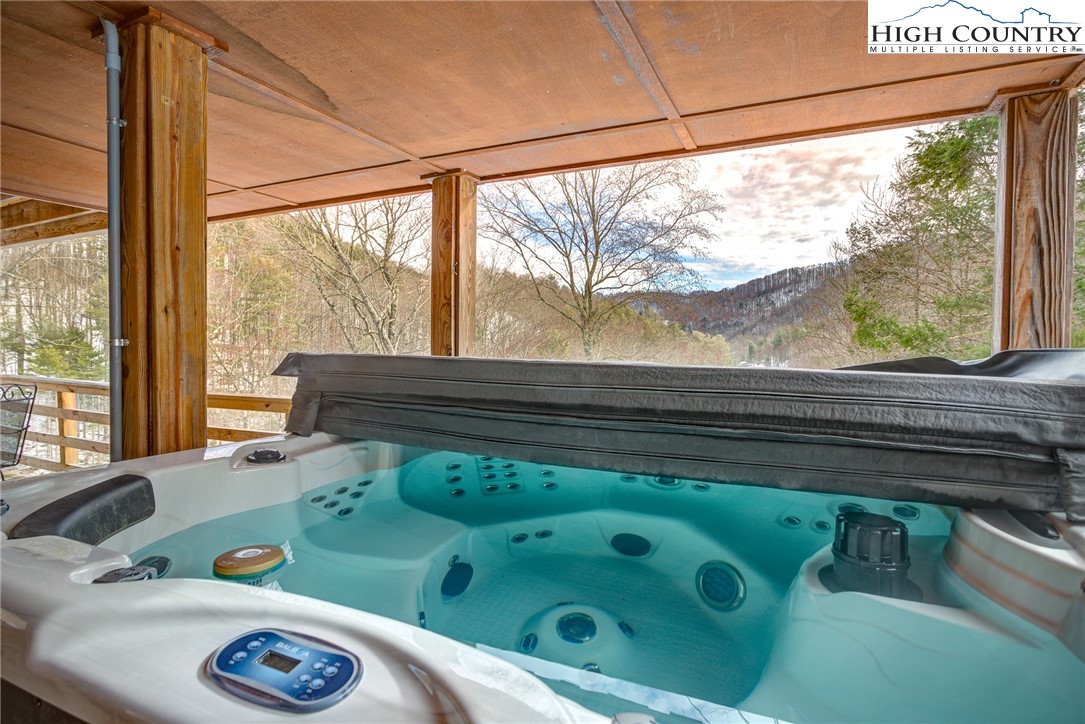 389 Auborn Trivette Road Sugar Grove, NC 28679 - Photo 28 of 49 a bathroom with a sink and a large window