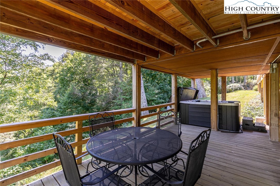 389 Auborn Trivette Road Sugar Grove, NC 28679 - Photo 29 of 49 a view of porch with a table and chairs