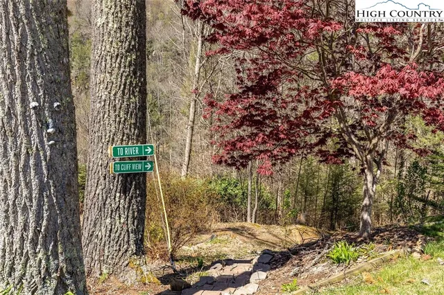 a view of lake with a patio