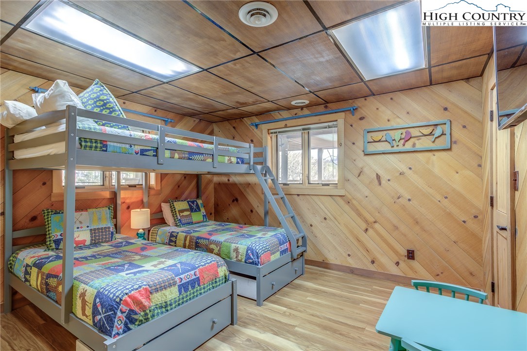 389 Auborn Trivette Road Sugar Grove, NC 28679 - Photo 34 of 49 a bedroom with bed and wooden floor