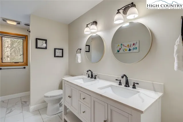 a view of sitting area with trees in a park