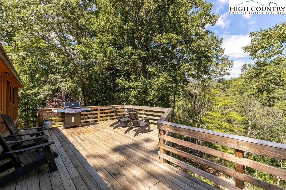 389 Auborn Trivette Road Sugar Grove, NC 28679 - Photo 36 of 49 a view of sitting area with trees in a park
