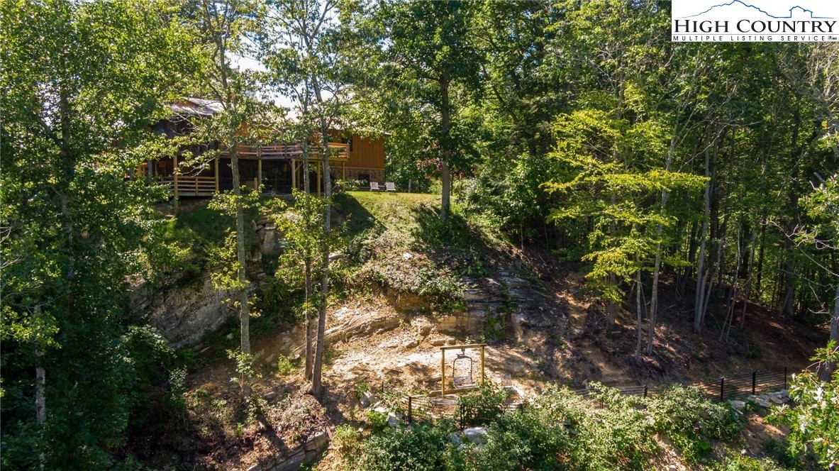 389 Auborn Trivette Road Sugar Grove, NC 28679 - Photo 39 of 49 a view of a house with a tree