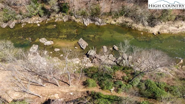 a view of a lake with sitting area