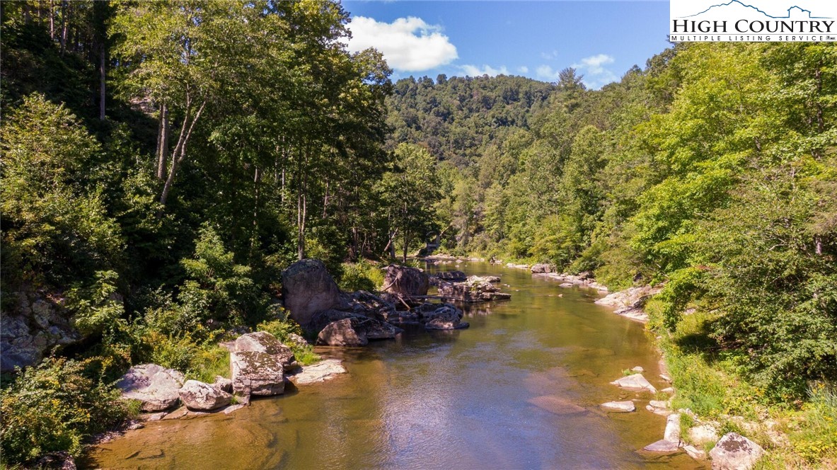 389 Auborn Trivette Road Sugar Grove, NC 28679 - Photo 5 of 49 a view of a lake with sitting area