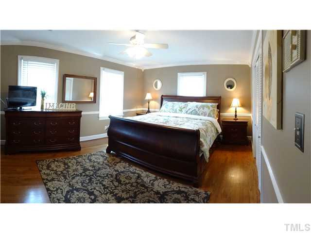 413 Kenwood Court Raleigh, NC 27609 - Photo 15 of 19 Imagine waking up in this gorgeous room! Beautiful lighting, large & bright, crown molding, and chair rail give this room a majestic feel. You may want to call down for room service! Bedroom