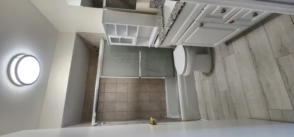 a view of an empty room with a window