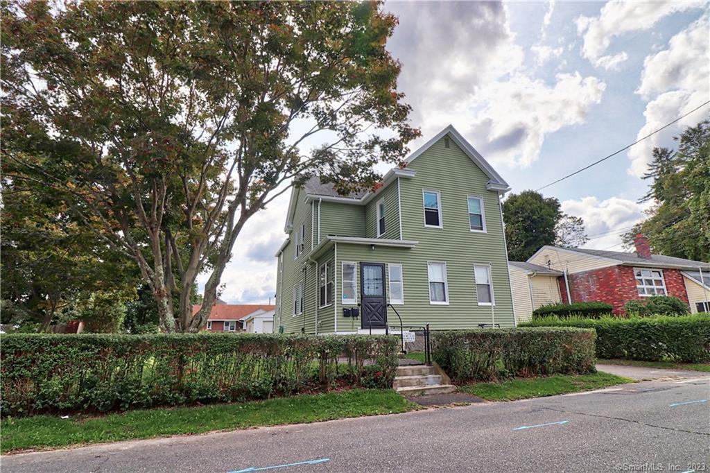 67 Avon Avenue Waterbury, CT 06708 - Photo 1 of 1 a front view of a house with a garden
