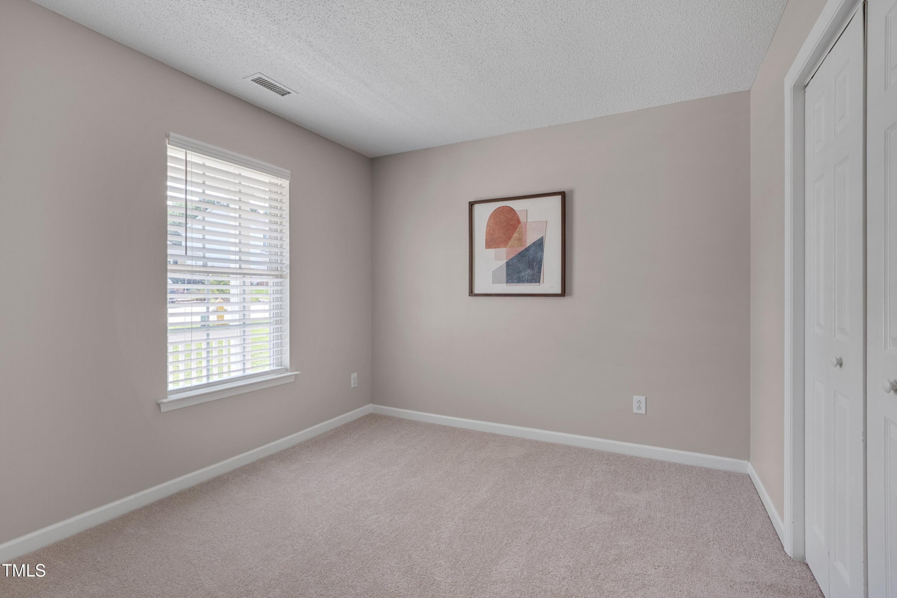 5000 Silverdene Street Raleigh, NC 27616 - Photo 9 of 12 an empty room with windows
