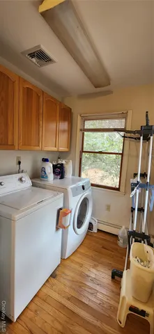 a front view of a house with a yard covered in snow