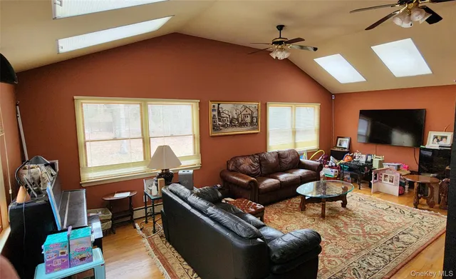 a room with furniture and a flat screen tv