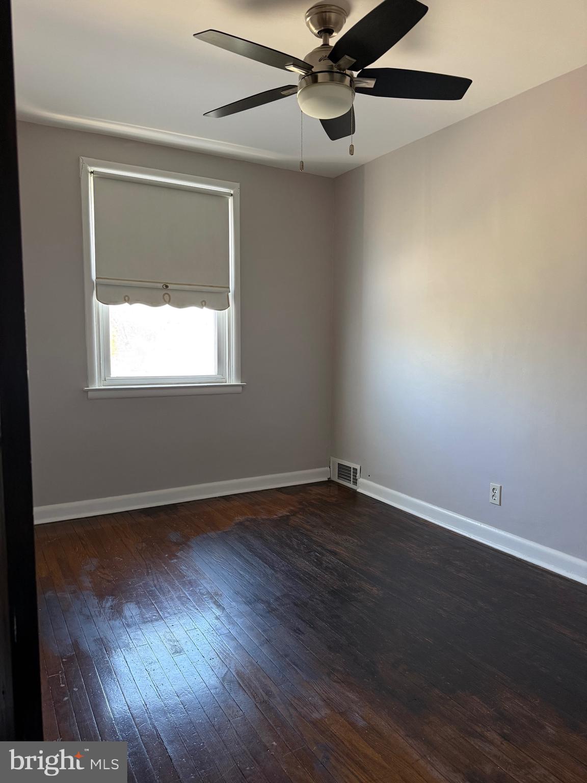 9083 Convent Avenue Philadelphia, PA 19136 - Photo 20 of 22 a view of an empty room with wooden floor and a window