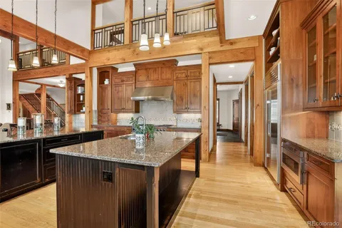 a kitchen with stainless steel appliances granite countertop a sink and counter space
