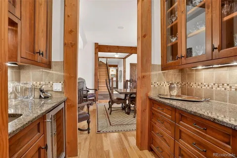 a view of a living room and bathroom with furniture