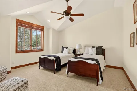 a bedroom with bed and window