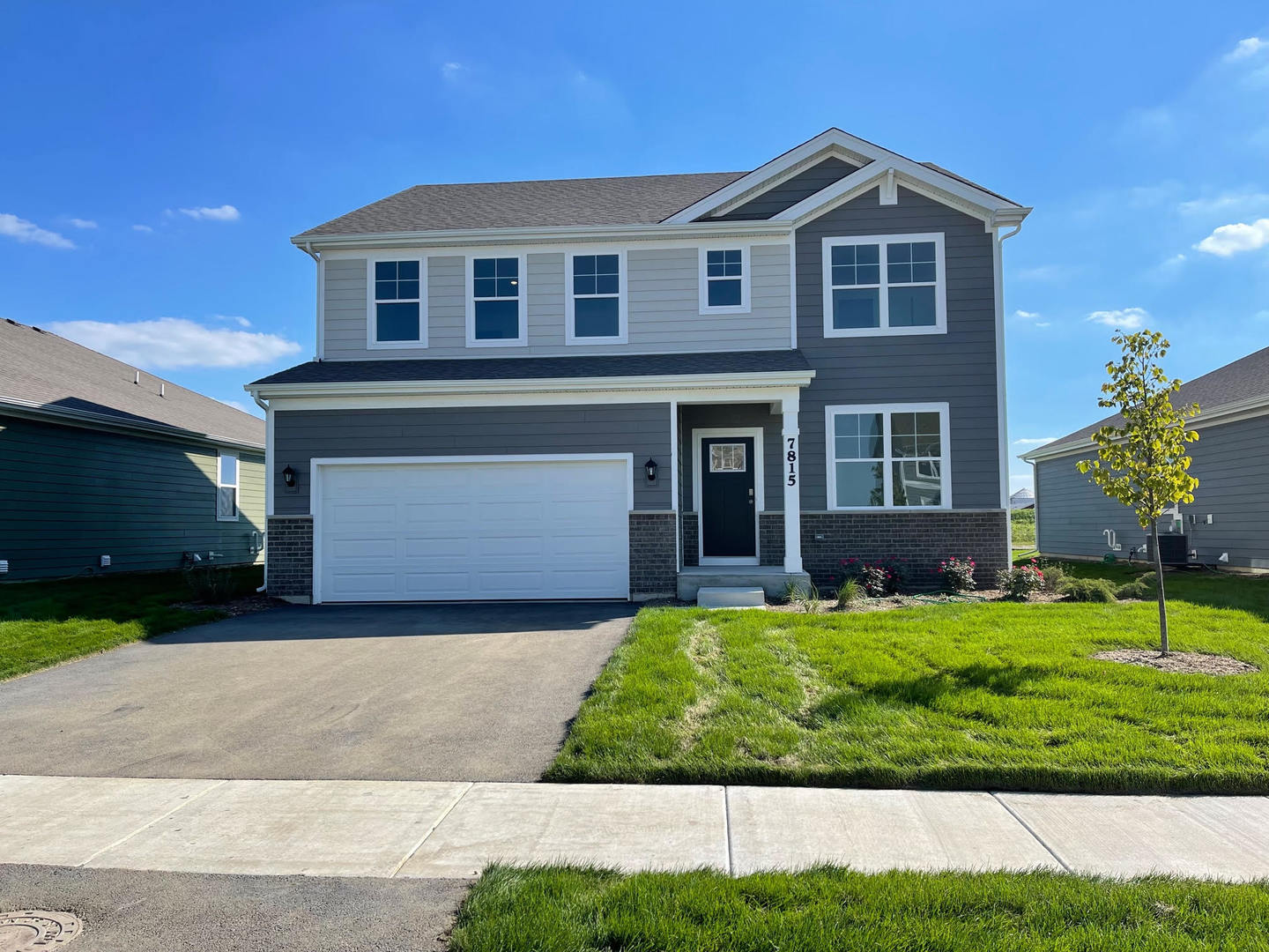 10453 Privet Drive St. John, IN 46307 - Photo 1 of 37 a front view of a house with a yard and garage