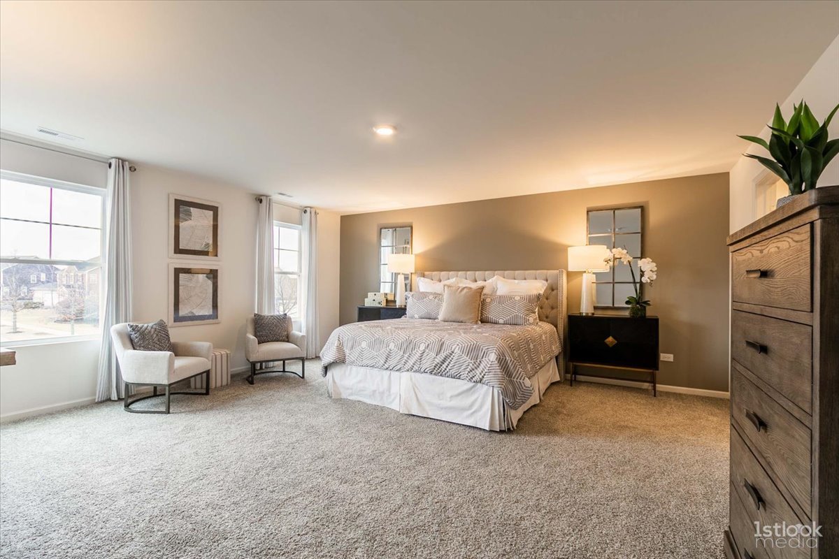 10453 Privet Drive St. John, IN 46307 - Photo 14 of 37 a spacious bedroom with a bed and furniture
