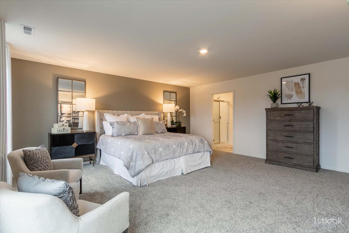 10453 Privet Drive St. John, IN 46307 - Photo 15 of 37 a spacious bedroom with a bed and furniture