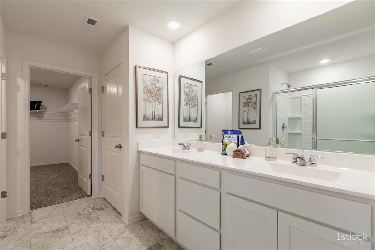 10453 Privet Drive St. John, IN 46307 - Photo 17 of 37 a bathroom with double sink and a mirror