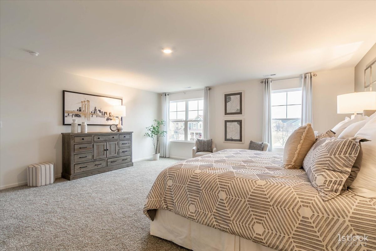 10453 Privet Drive St. John, IN 46307 - Photo 19 of 37 a bedroom with a large bed and a window