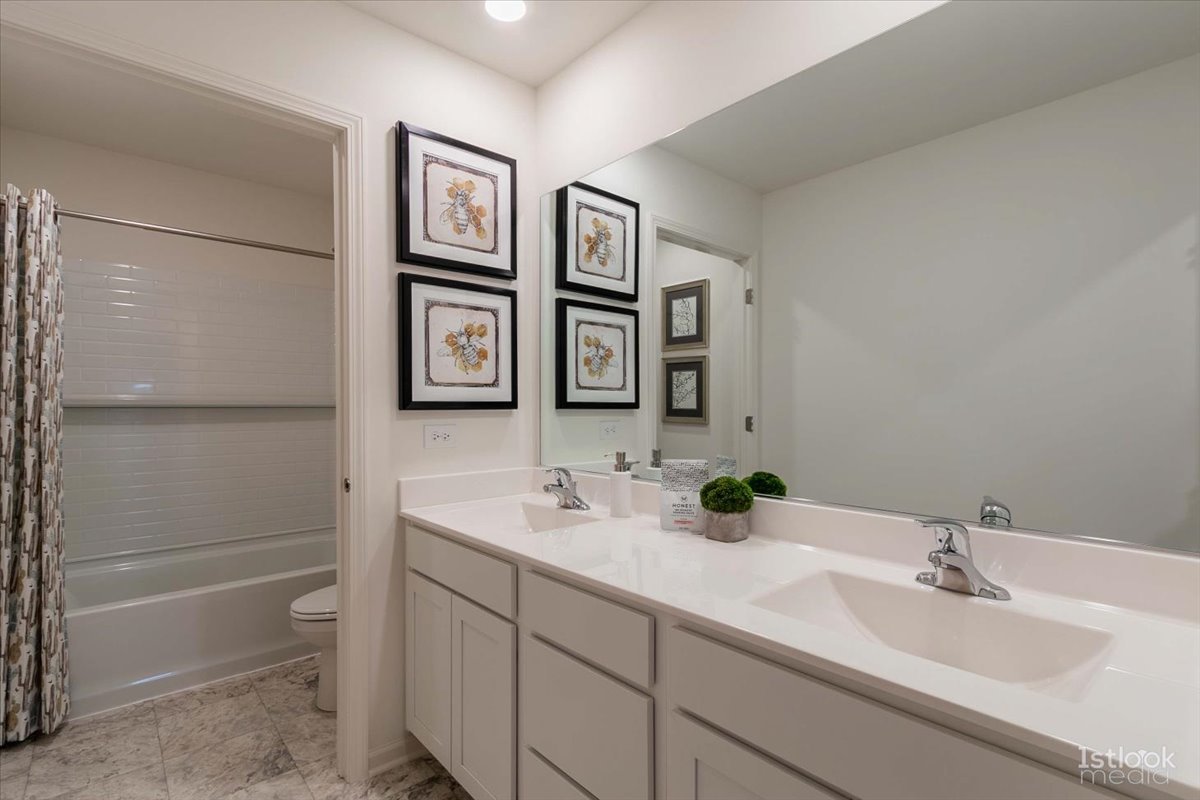 10453 Privet Drive St. John, IN 46307 - Photo 24 of 37 a bathroom with a double vanity sink and a