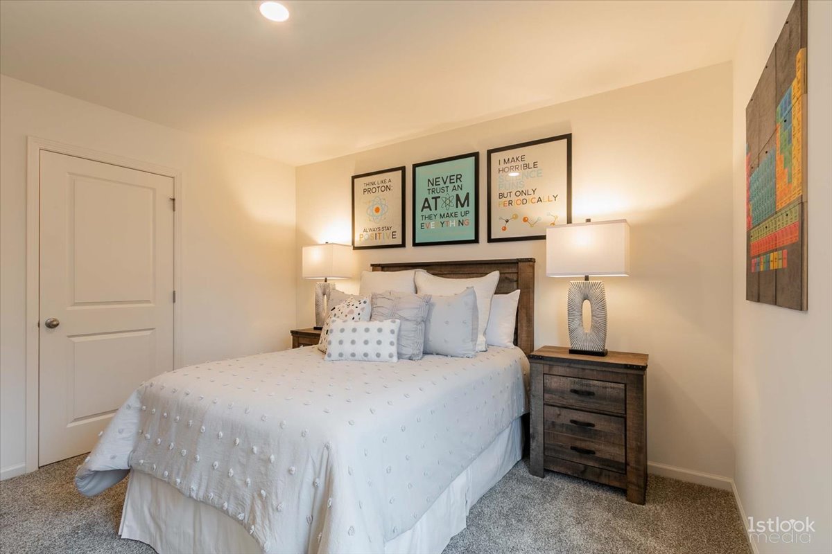 10453 Privet Drive St. John, IN 46307 - Photo 28 of 37 a bedroom with a bed and a night stand